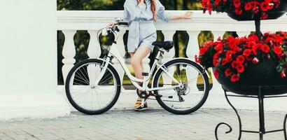 Charming woman with a bicycle photo