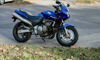 Blue Honda Hornet motorcycle. photo