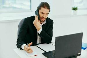 businessmen at the desk documents communication by phone boss photo