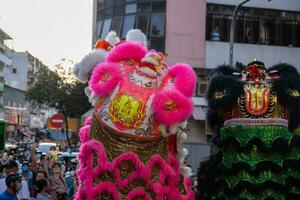 Ho Chi Minh city, Vietnam - 6 Feb 2023 Lunar New Year celebration - The dragon dance, beautiful colorful festive figure. Tet holiday background. Chinese Lunar New Year's Day, Spring Festival. photo