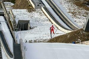 ski jumper while jumping photo