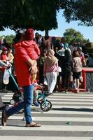 Kudus, January 2023. A snapshot of the crowds of car free day visitors crossing the zebra crossing to get to alun alun simpang 7 kudus. photo