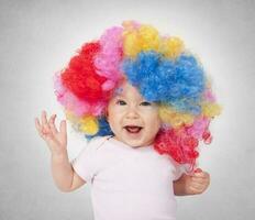 Baby with clown wig photo