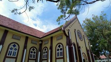Kampar, Perak, Malaysia, May 02 2022, Slowly move and view the architecture of Sacred Heart Church in blue sky day video
