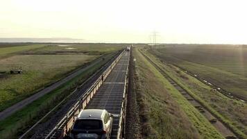 Moto Rail Train Carrying Vehicles and Passengers on a Journey video