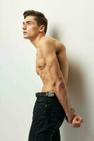 Male topless black trousers muscles attractive look photo