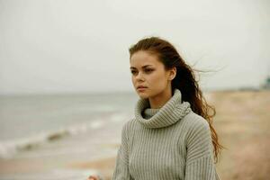 beautiful woman with long hair on the beach nature landscape walk Happy female relaxing photo