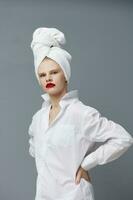 glamorous woman red lips towel on head makeup Gray background photo