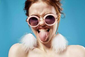 woman bare shoulders fluffy earrings fashion glasses close-up photo