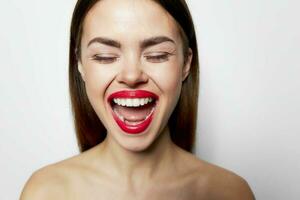 Emotional woman with wide open mouth and closed eyes photo