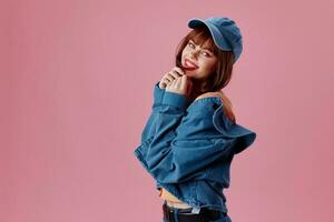 Beautiful fashionable girl denim cap red lips glamor fashion pink background unaltered photo