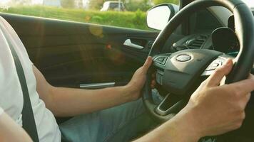 Man driving in innovative automated car using self-parking autopilot for parking on parking lot video