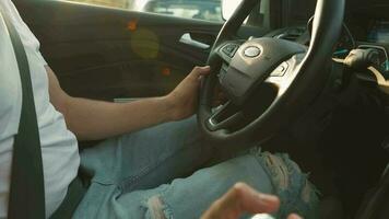 Man driving in innovative automated car using self-parking autopilot for parking on parking lot video