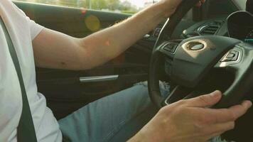 Man driving in innovative automated car using self-parking autopilot for parking on parking lot video