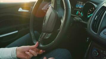 Man driving in innovative automated car using lane holding function. Robotic computer turning wheel in auto steering mode. Concept of modern technology in the automotive industry video