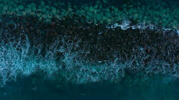 Aerial view of surface of the Atlantic Ocean with reflection of sunlight at sunset video