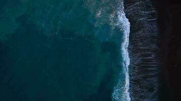 Aerial view of surface of the Atlantic Ocean with reflection of sunlight at sunset video