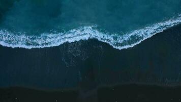 Aerial view of surface of the Atlantic Ocean with reflection of sunlight at sunset video