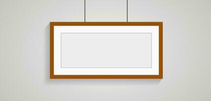 A wide picture frame style on wall art for decorection, wooden frame with passepartout leaning against the white wall. Horizontal blank elegant frame template vector