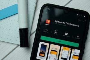 Digibank by DBS dev app with magnifying on Smartphone screen. Digibank by DBS is a freeware web browser developed by PT Bank DBS Indonesia. BEKASI, WEST JAVA, INDONESIA. OCTOBER 3, 2020 photo