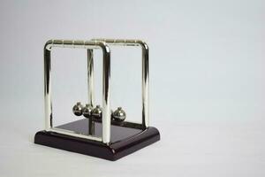 Newton's cradle work. Education, science and physics concept isolated white background photo