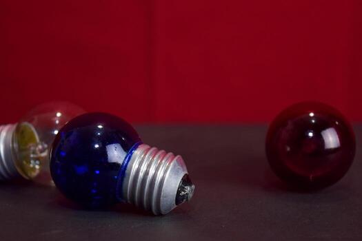 Close up lamp in red background and black table photo