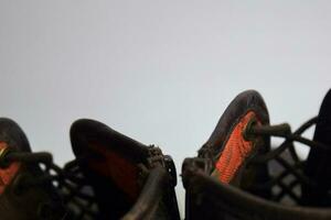 Close up of a brown old boots isolated on white background photo