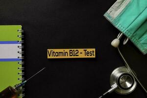 Vitamin B12 - Test on top view black table with blood sample and Healthcare medical concept. photo