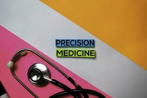 Precision Medicine text on sticky notes with color office desk. Healthcare Medical concept photo