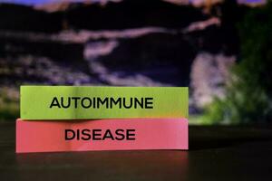 Autoimmune Disease on the sticky notes with bokeh background photo