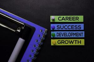 Career, Success, Development, Growth text on sticky notes isolated on Black desk. Mechanism Strategy Concept photo