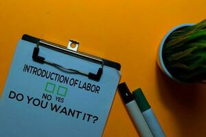 Introduction of Labor, Do You Want it Yes or No. On office desk background photo