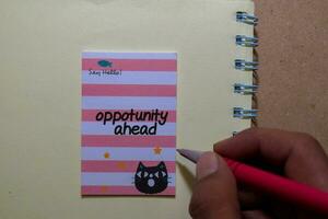 Opportunity Ahead write on sticky notes isolated on Office Desk photo