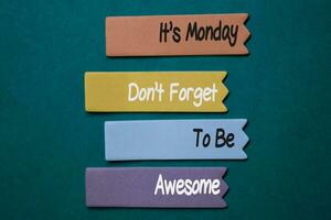 It's Monday Don't Forget to be Awesome write on sticky note isolated on Office Desk photo