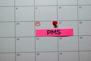 Premenstrual syndrome PMS write on calendar. Date 16. Reminder or Schedule Concepts photo