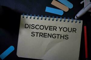 Discover Your Strengths write on a book isolated on Office Desk. photo