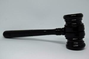 Close up black gavel isolated on White Background. justice concept photo