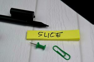 Slice write on sticky notes isolated on office desk photo