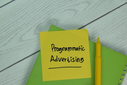 Programmatic Advertising text on sticky notes isolated on office desk photo