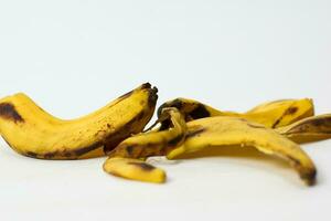 Close up yellow banana peel isolated on white background photo