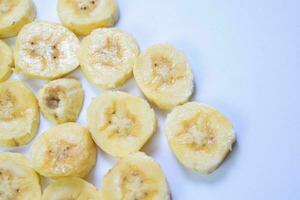 Close up slice yellow banana isolated on white background photo