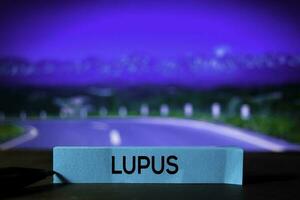 Lupus on the sticky notes with bokeh background photo