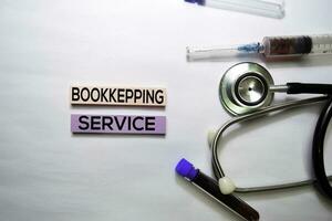 Bookkeeping Service text on top view isolated on white background. Healthcare Medical concept photo