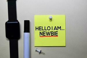 Hello I am Newbie text on sticky notes isolated on office desk photo