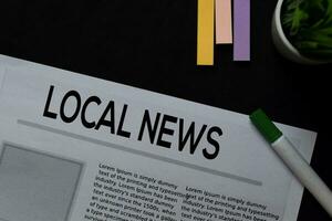 Local News text in headline isolated on Black background. Newspaper concept photo