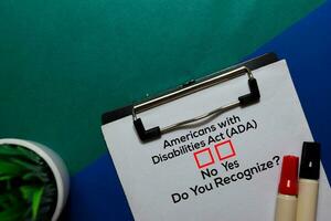 Americans with Disabilities Act , Do You Rezognize Yes or No. On office desk background photo