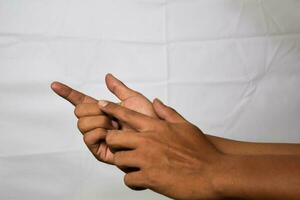 Close up Asian man view counting something isolated on white background photo