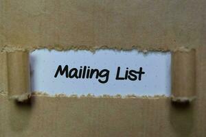 Mailing List write on white and brown torn paper photo