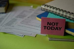 Not Today write on a sticky note isolated on Office Desk. Business Document concept photo