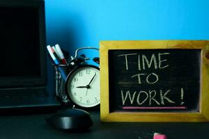 Time to Work Planning on Background of Working Table with Office Supplies. Business Concept Planning on Blue Background photo